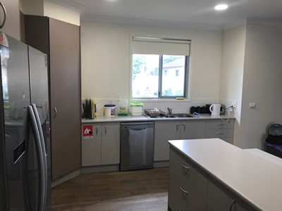 Accessible kitchen in self-contained unit in Lifestyle Solutions Specialist Disability Accommodation in Argenton, Newcastle, NSW