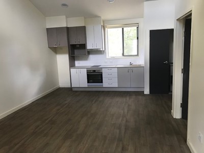 Storage space and features in accessible kitchen in self-contained unit in Lifestyle Solutions Specialist Disability Accommodation in Argenton, Newcastle, NSW