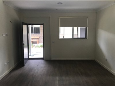 Accessible doorway leading to outdoor seating in self-contained unit in Lifestyle Solutions Specialist Disability Accommodation in Argenton, Newcastle, NSW