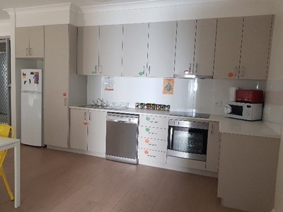 Accessible shared kitchen in Lifestyle Solutions Supported Independent Living property in Albion Park Rail, NSW