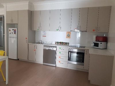 Accessible shared kitchen in Lifestyle Solutions Supported Independent Living property in Albion Park Rail, NSW