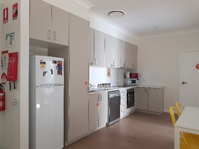Accessible shared kitchen in Lifestyle Solutions Supported Independent Living property in Albion Park Rail, NSW
