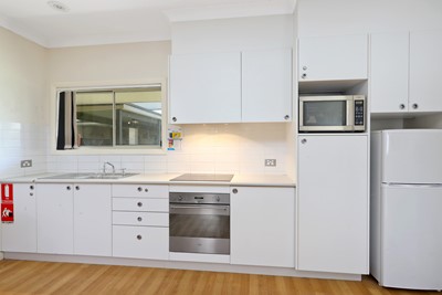 Kitchen in villa in Lifestyle Solutions Supported Independent Living property with five self-contained villas in Quakers Hill, Sydney