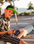 Foster Care for a young boy looking at his phone