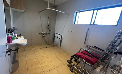 Accessible bathroom with disabled toilet in Lifestyle Solutions three-bedroom Specialist Disability Accommodation (SDA) in Pallara, Qld