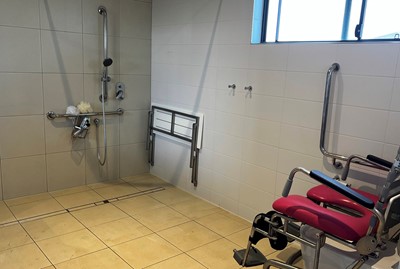 Accessible shower and diabled toilet in bathroom  in Lifestyle Solutions three-bedroom Specialist Disability Accommodation (SDA), Pallara, Queensland (SDA) in Pallara, Qld