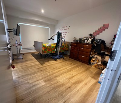 Accessible bedroom with disability aids in  Lifestyle Solutions three-bedroom Specialist Disability Accommodation in Pallara, Qld