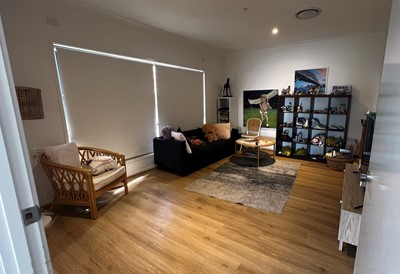 Accessible lounge in Lifestyle Solutions three-bedroom Specialist Disability Accommodation (SDA) in Pallara, Qld