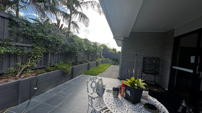 Accessible covered outdoor eating area and verandah in Lifestyle Solutions three-bedroom Specialist Disability Accommodation (SDA) in Pallara, Qld