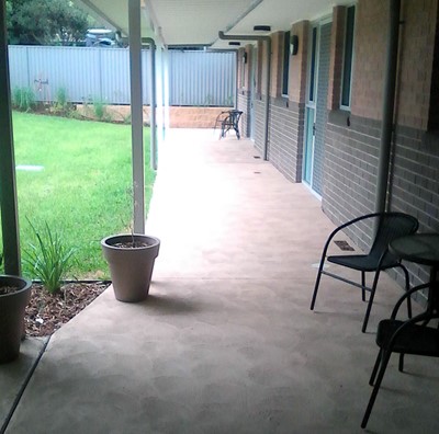 Accessible outdoor area with garden in Lifestyle Solutions Supported Independent Living property in Albion Park Rail, NSW