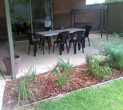 Shared outdoor entertainment area in Lifestyle Solutions Supported Independent Living property in Albion Park Rail, NSW