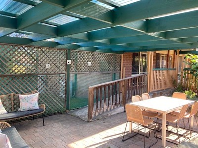 Ramp and outdoor entertainment area in Lifestyle Solutions two-bedroom Supported Independent Living accommodation in Warabrook, NSW