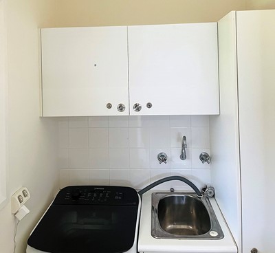 Laundry in villa in Lifestyle Solutions Supported Independent Living property with five self-contained villas in Quakers Hill, Sydney