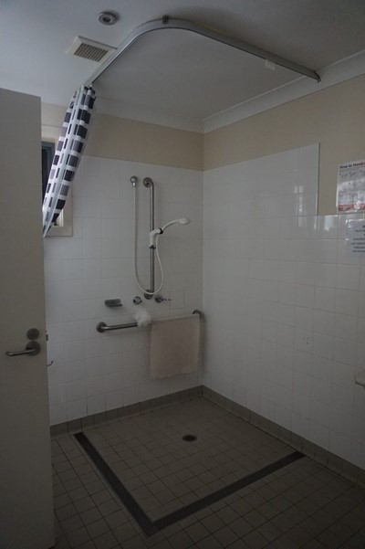 Large accessible shower area in apartment bathroom  at Lifestyle Solutions Supported Independent Living property in Wyong, NSW