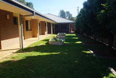 Outdoor areas and communal garden  at Lifestyle Solutions Supported Independent Living property in Wyong, NSW
