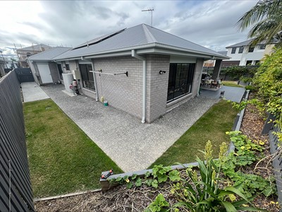 Back and sides of house with fully accessible pathways in Lifestyle Solutions three-bedroom Specialist Disability Accommodation (SDA) in Pallara, Qld