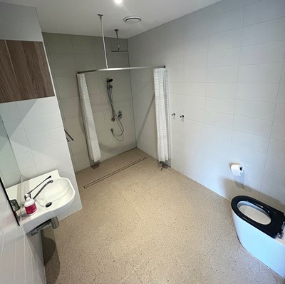 Fully accessible en-suite bathroom in Lifestyle Solutions three-bedroom Specialist Disability Accommodation (SDA) in Pallara, Qld