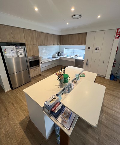 Fully accessible kitchen in Lifestyle Solutions three-bedroom Specialist Disability Accommodation (SDA) in Pallara, Qld