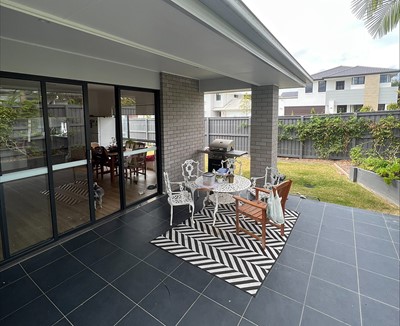 Covered outdoor entertainment area and BBQ in Lifestyle Solutions three-bedroom Specialist Disability Accommodation (SDA) in Pallara, Qld