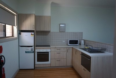 Accessible kitchen in villa in Lifestyle Solutions Supported Independent Living property with two self-contained villas in Fairfield, Sydney