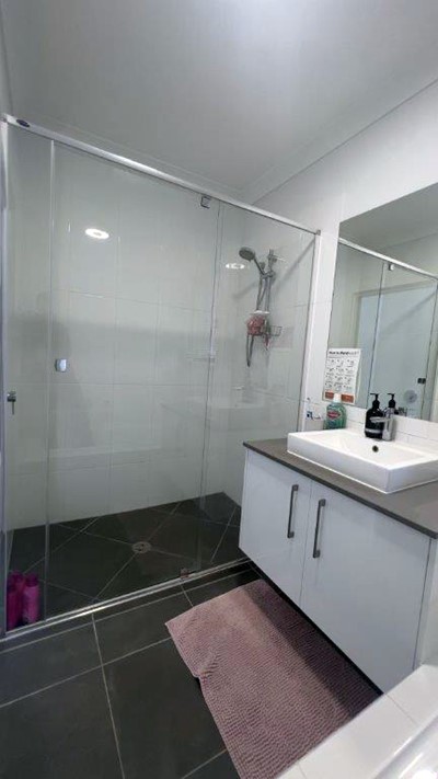Bathroom showing shower and sink in Lifestyle Solutions Supported Independent Living accommodation in Pallara, Qld