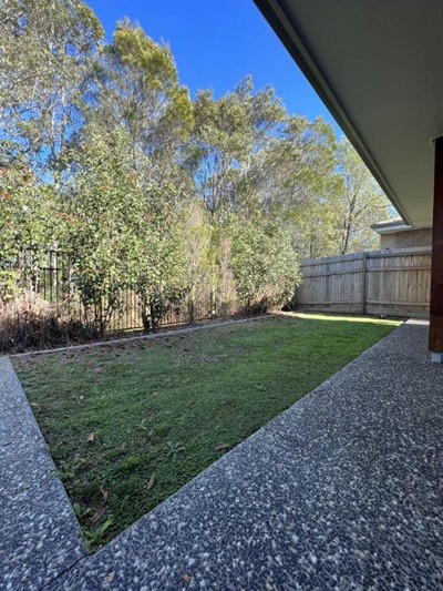 Lawn and trees in Lifestyle Solutions Supported Independent Living accommodation in Pallara, Qld